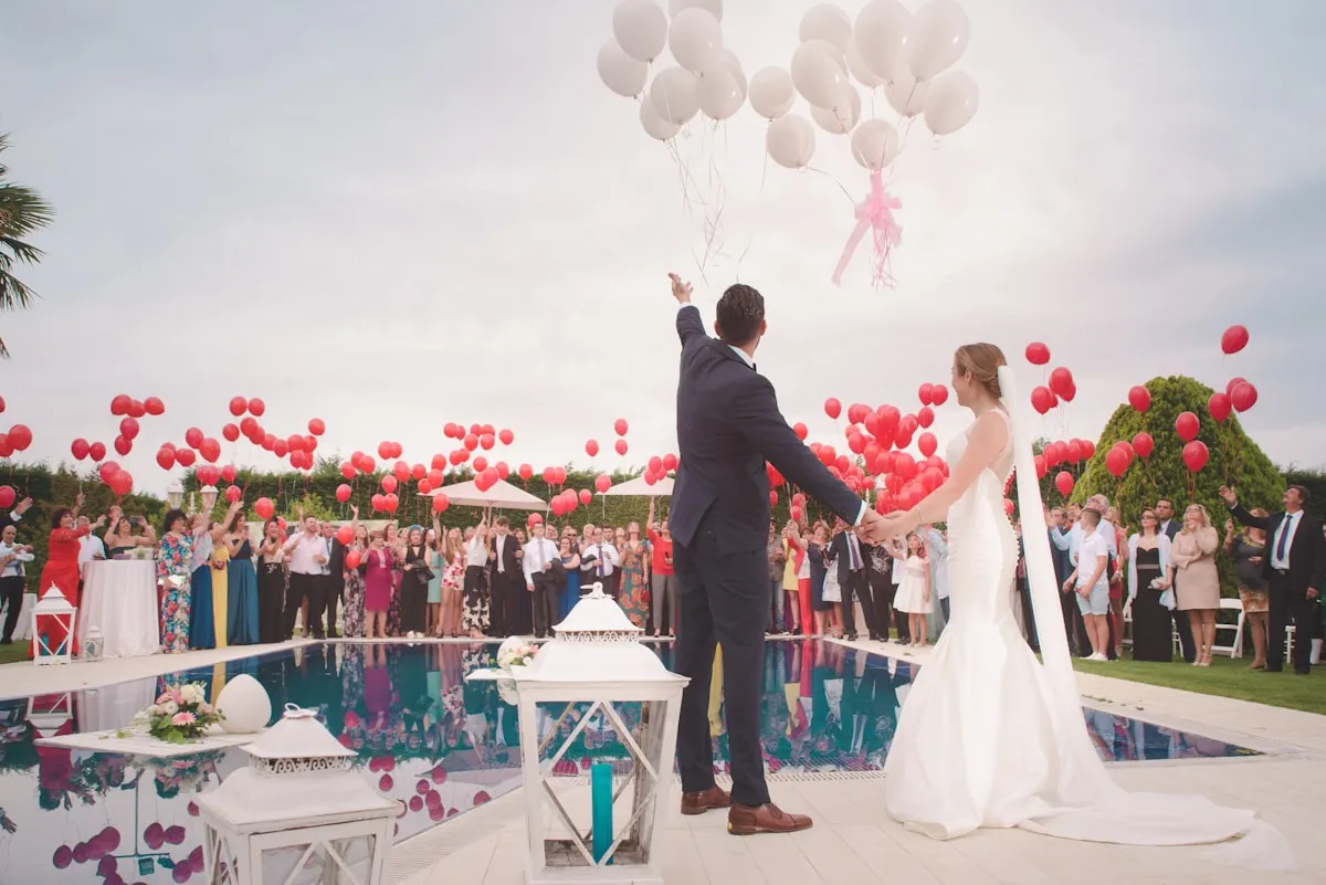 Candid wedding reception with guests at a decorated table